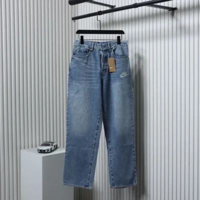 Levi’S X Nike Loose Fitting Jeans With Ribbed Trim Snap Buttons And Lettering Patch