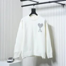 AMI Sweater In A Minimalist French Style With A Round Neckline And A Silver Heart Logo